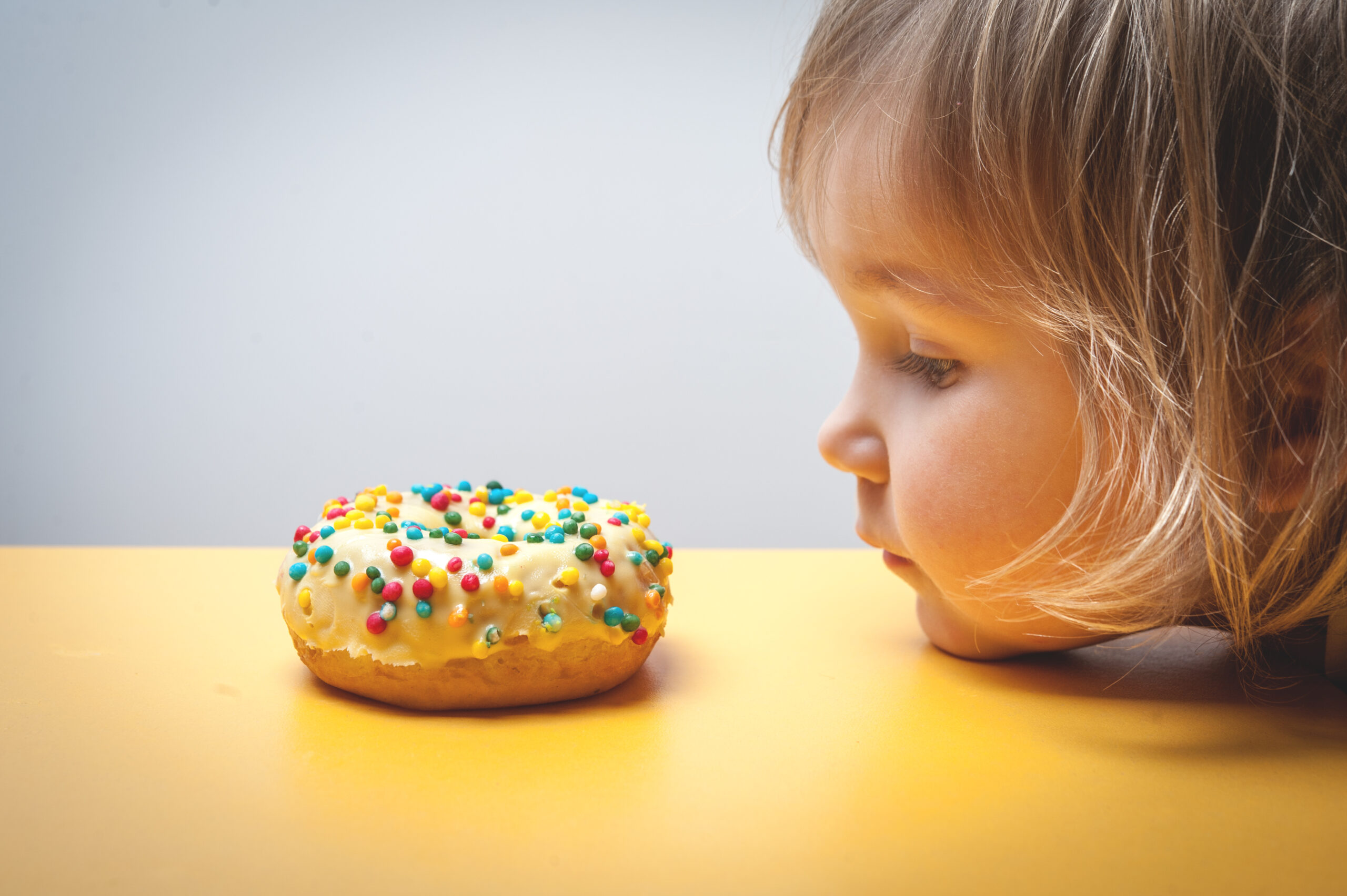 Diet,For,Kids.,Sad,And,Unhappy,Child,Child,Reaches,Donuts.